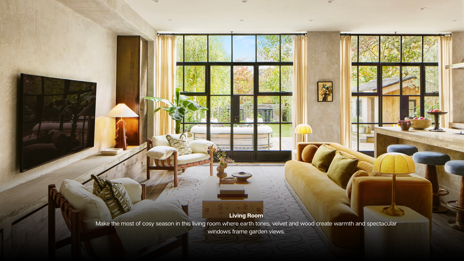 Living Room Make the most of cosy season in this living room where earth tones, velvet and wood creae warmth and spectacular windows frame garden views. Kitchen Island Take centre stage on a elect
